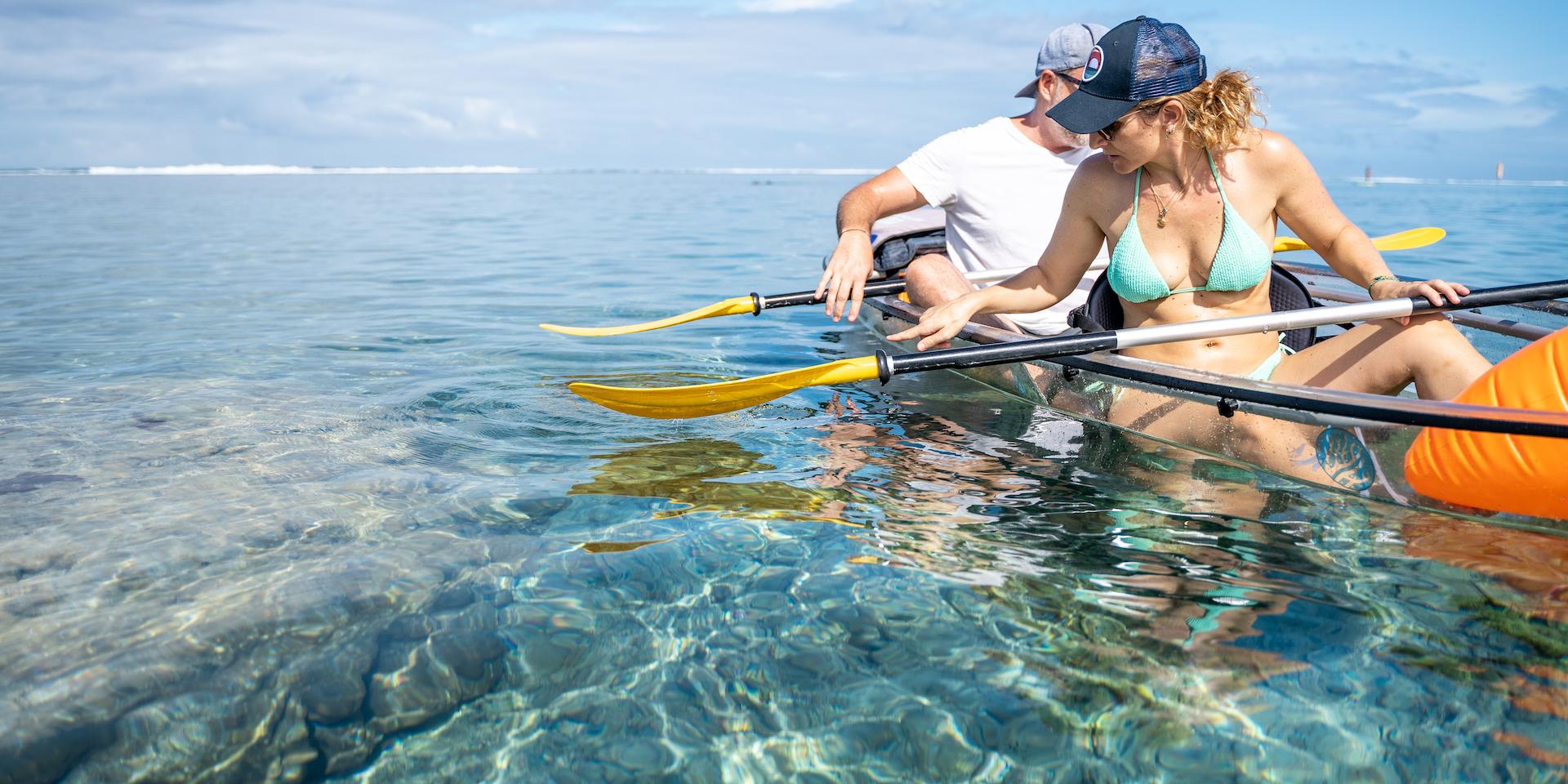 Sunset in transparent kayak and paddle